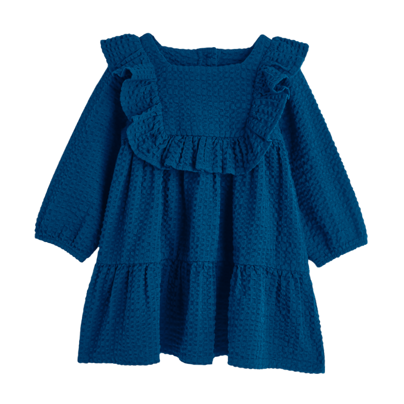 Blue textured dress with ruffled shoulders on a white background