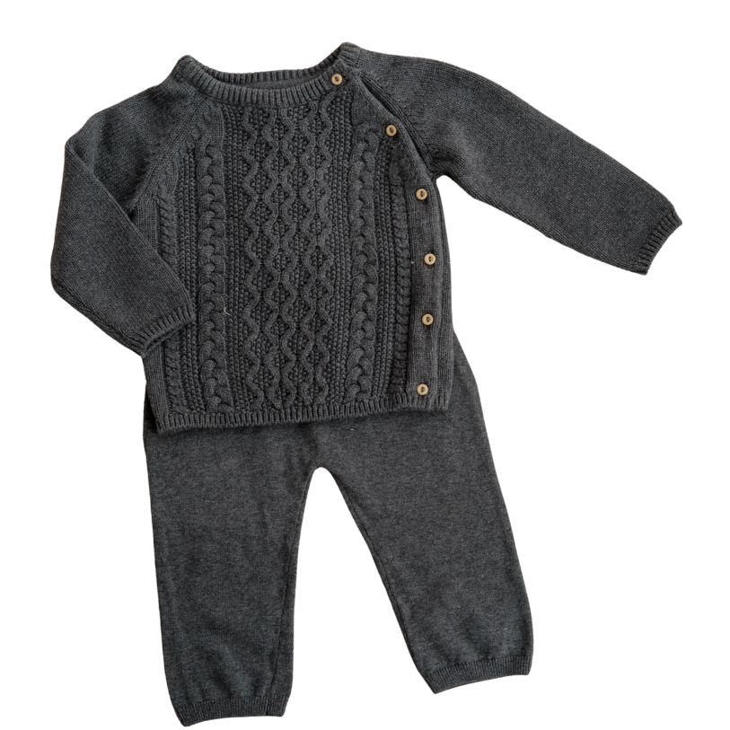 Gray knitted sweater and pants set on a white background