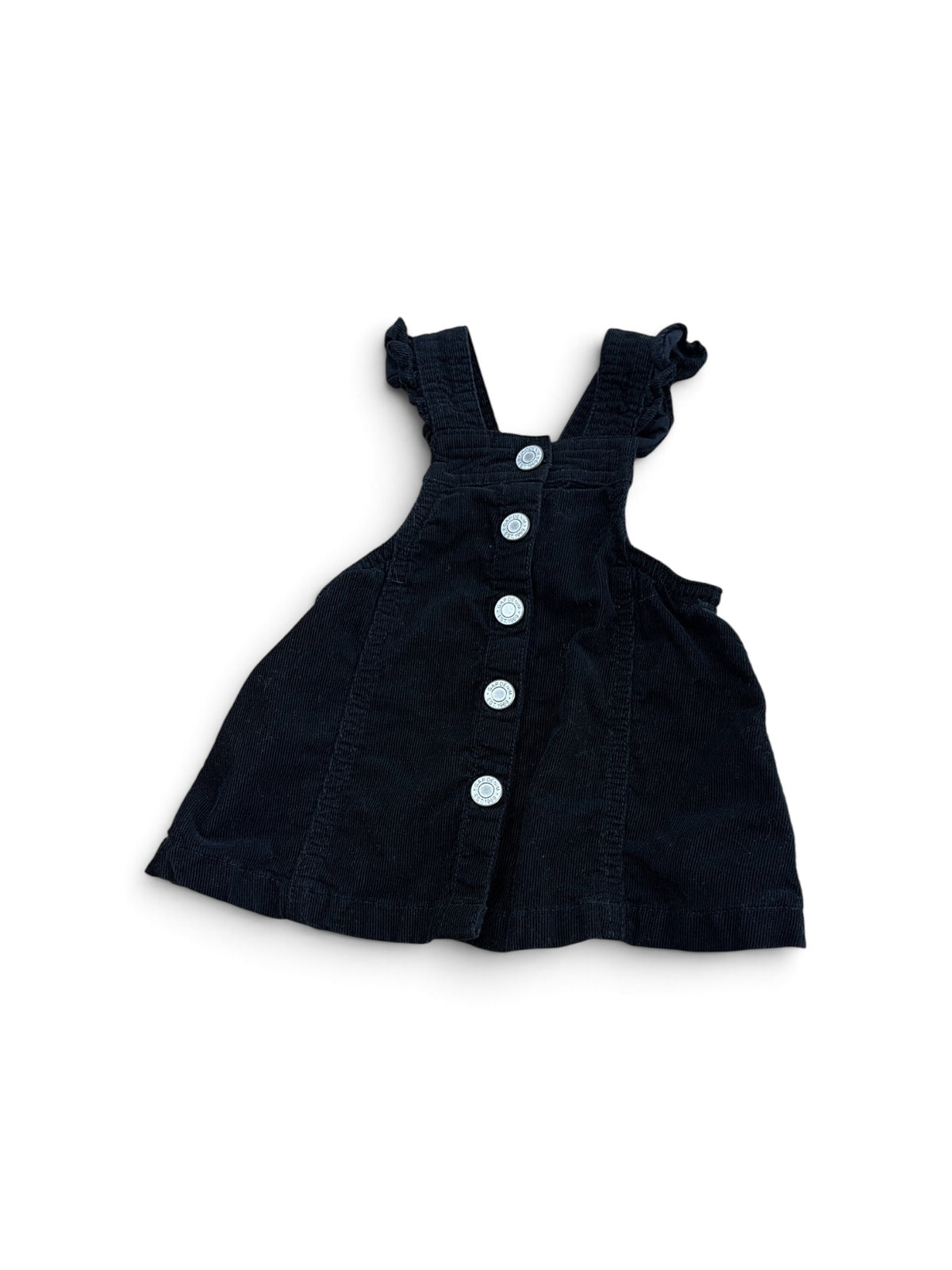 Baby Gap black corduroy jumper dress with ruffled shoulder straps and front button closure.
