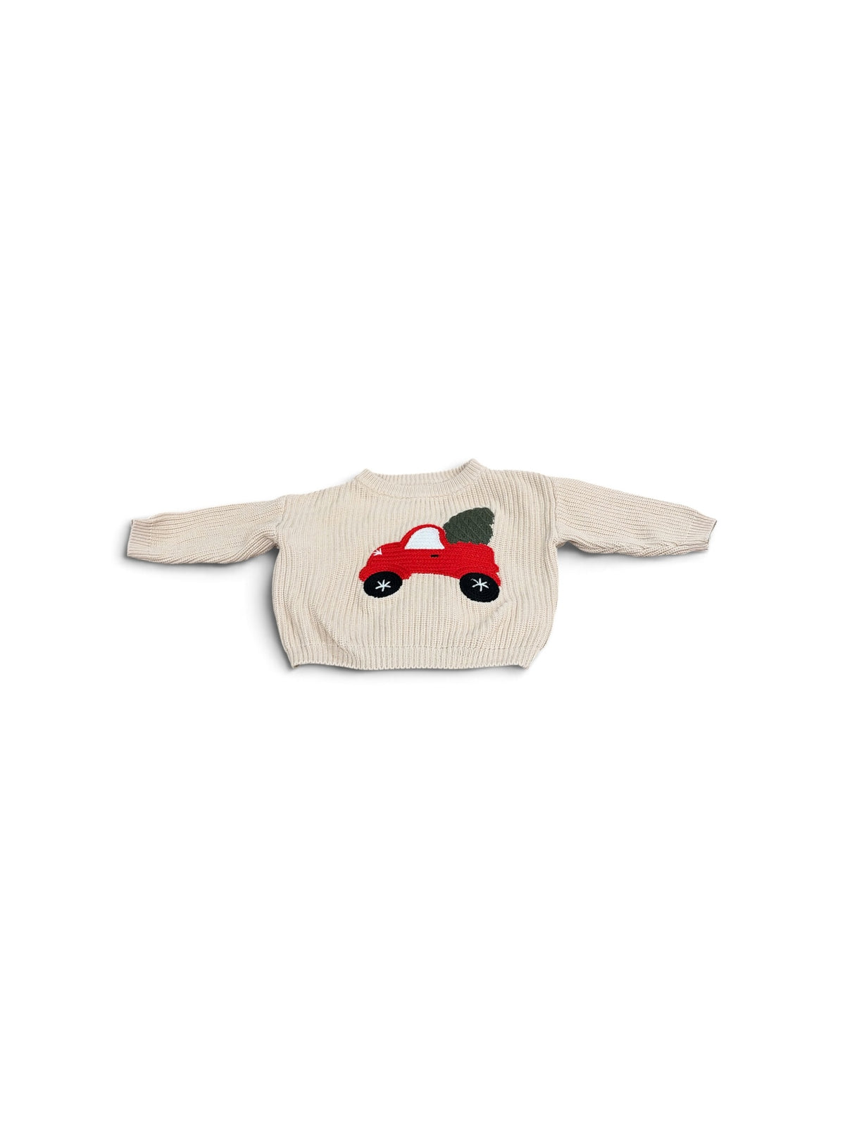 Toddler beige knit sweater featuring a red car carrying a Christmas tree on the front.