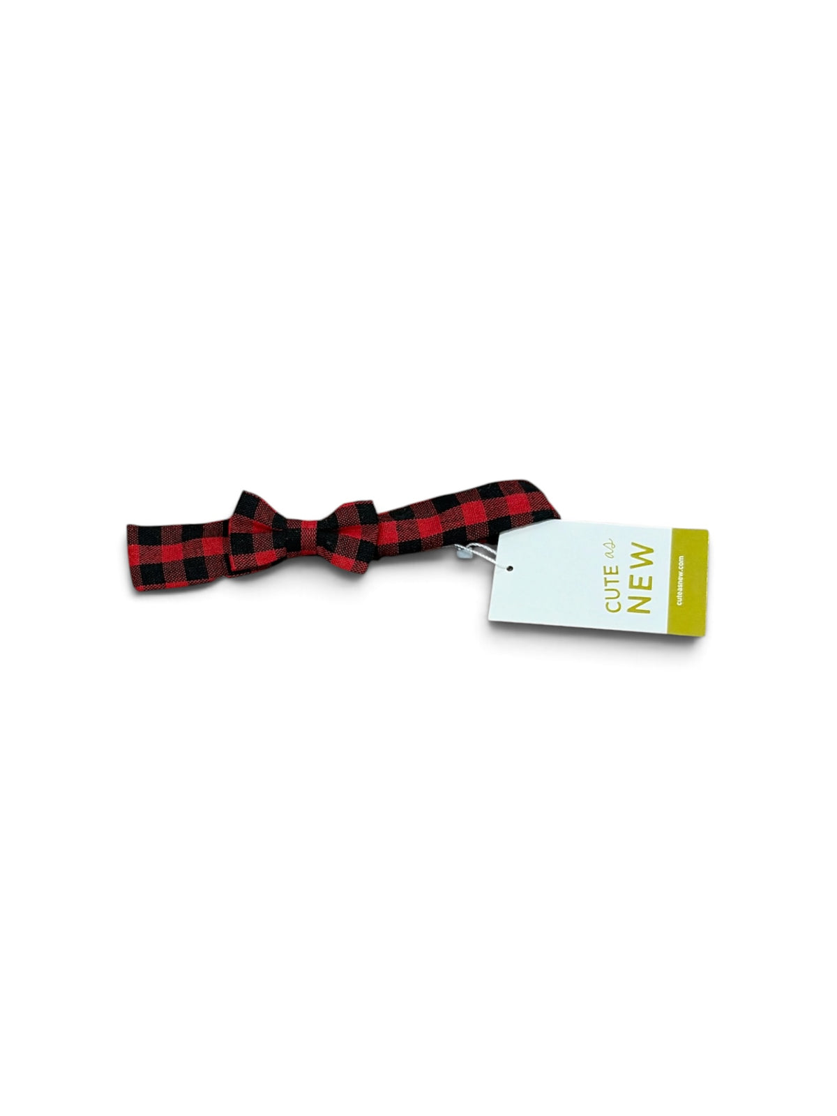 Red and black buffalo plaid fabric bow hair accessory with a Cute as New brand tag attached.