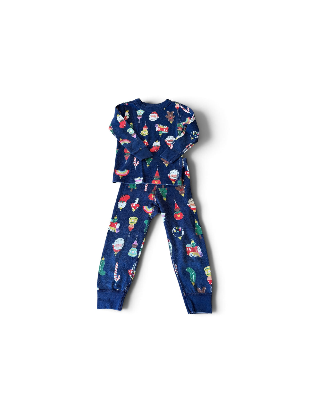 Hanna Andersson toddler navy blue cotton pajama set featuring a festive holiday ornament and Santa print.