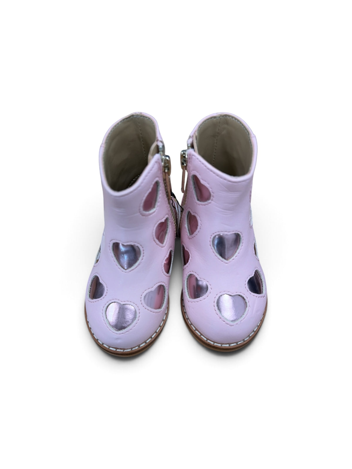 Janie and Jack toddler boots in light pink leather featuring metallic heart cutouts and side zipper closure.