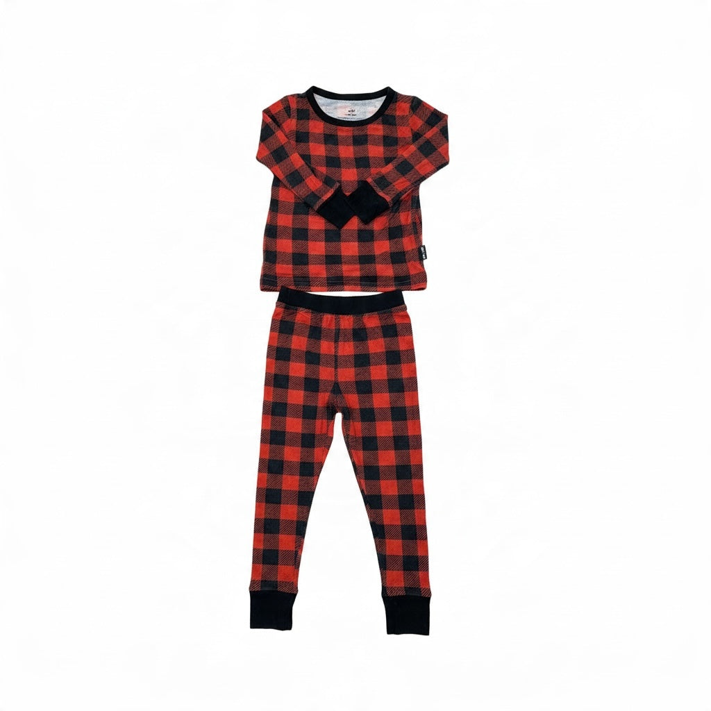 Millie + Roo toddler pajama set in red and black buffalo plaid with long sleeves and black ribbed cuffs.