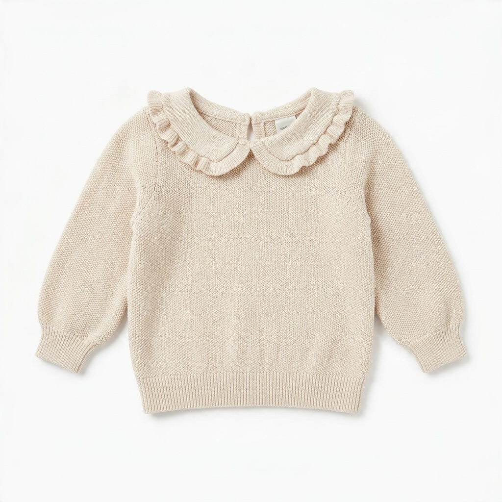 Nordstrom baby cream knit sweater with a ruffled Peter Pan collar and long sleeves.