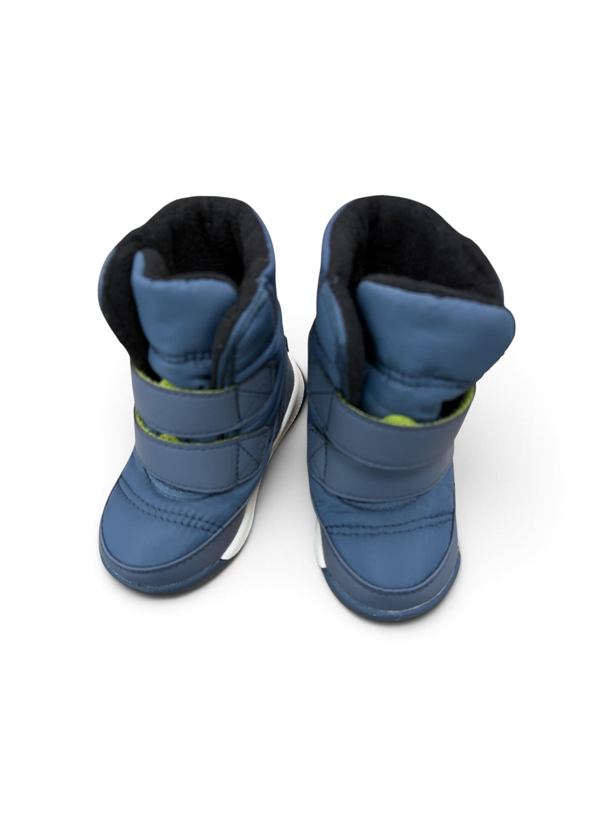 Sorel navy blue toddler snow boots with velcro straps and black fleece lining, top-down view.