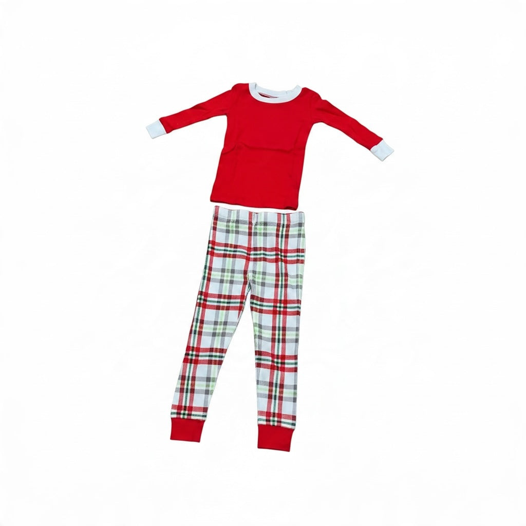 Toddler holiday pajama set with a red long-sleeve top and white, red, and green plaid pants.