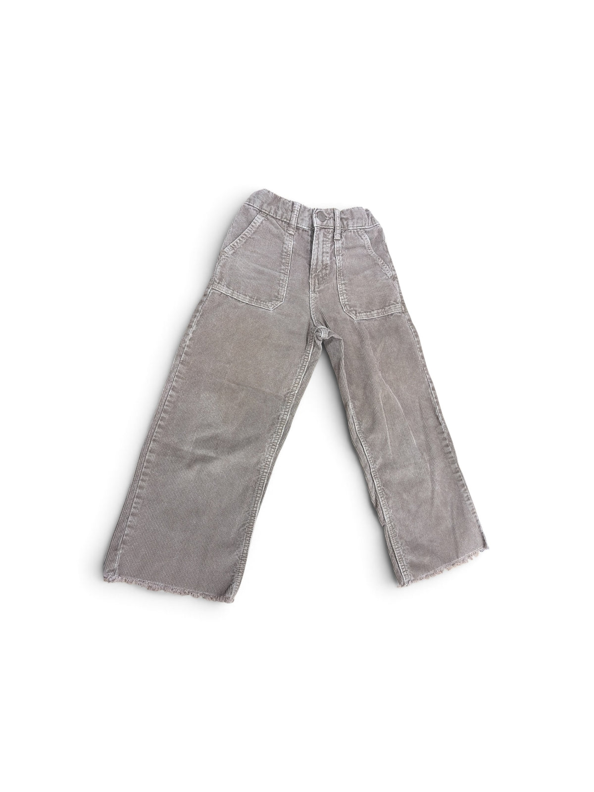Zara kids rust corduroy pants with front patch pockets and frayed raw hem detail.